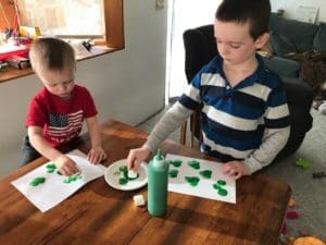 kids doing shamrock craft