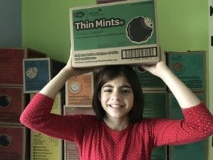 girl with cookies on head