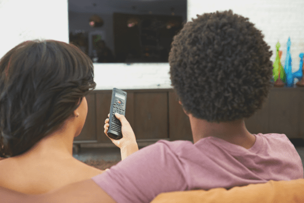 couple with tv remote