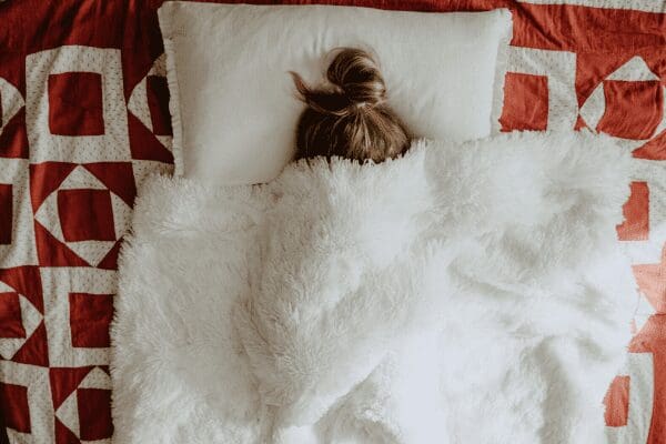woman sick in bed