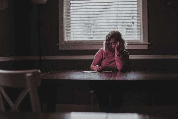woman alone at table