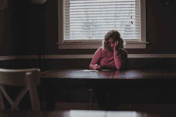 woman alone at table