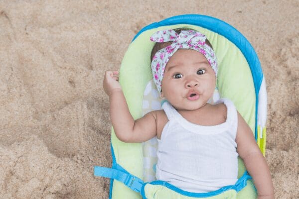 baby in bouncy chair