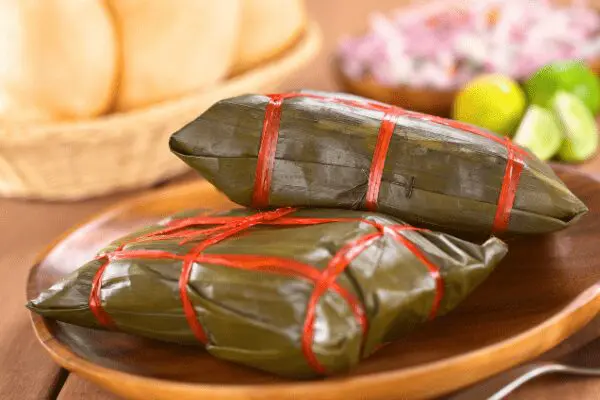 tamales wrapped in banana leaves