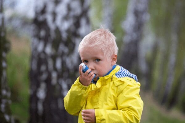 child with asthma inhaler