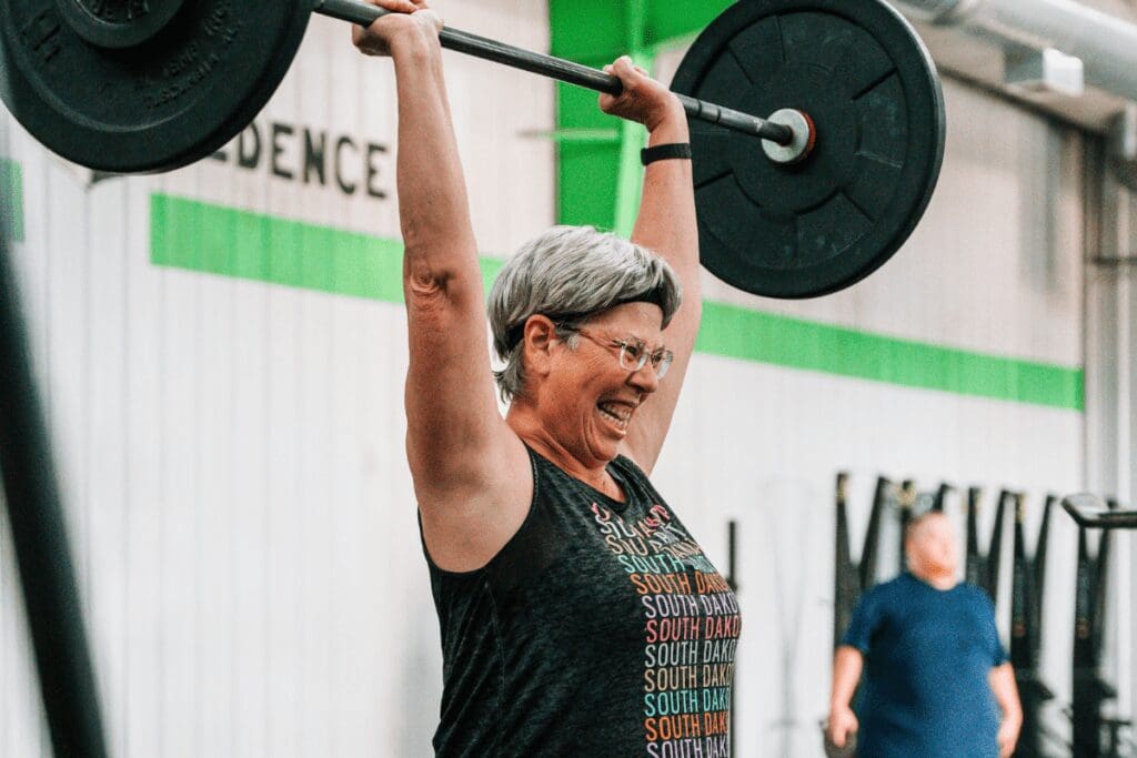 Woman lifting weights at CrossFit Credence in Rochester, MN