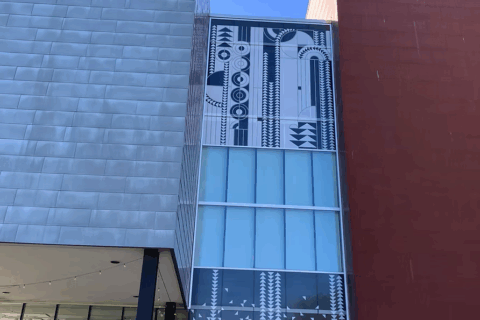 Ascend art by Alyssa Baguss, visible on the rear windows of the Rochester Art Center. 